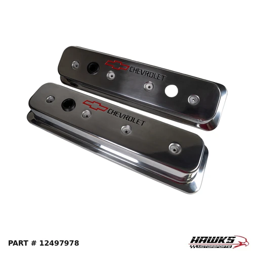 Polished aluminum small-block Chevy center-bolt valve cover pair showing Chevrolet logos and oil fill openings, alternate angle, part 12497978.