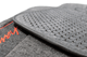 Front carpet floor mat pair fitment and installation-detail view of the underside grippers.