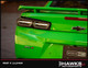  Close-up of a Morimoto LF404 smoked tail lamp installed at the rear of a green Camaro. Hawks Motorsports frame labeled PART # 1xLF404.