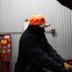 Hawks Motorsports Hunter Orange & Camo Leather Patch Snapback | Richardson 880 (HAWKSCAMOHAT) on person
