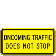 Oncoming Traffic Does Not Stop Warning Plaques