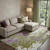 9' X 12' Olive Green Purple And Ivory Abstract Washable Area Rug With UV Protection 9' X 12' Olive Green Purple And Ivory Abstract Washable Area Rug With UV Protection