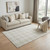 5' X 8' Ivory Brown And Beige Plaid Washable Area Rug With UV Protection 5' X 8' Ivory Brown And Beige Plaid Washable Area Rug With UV Protection