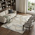 8' X 10' Beige Taupe And Gray Abstract Washable Area Rug With UV Protection 8' X 10' Beige Taupe And Gray Abstract Washable Area Rug With UV Protection