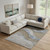10' X 14' Taupe And Blue Abstract Washable Area Rug With UV Protection 10' X 14' Taupe And Blue Abstract Washable Area Rug With UV Protection