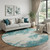 8' Teal And Ivory Abstract Washable Round Rug With UV Protection 8' Teal And Ivory Abstract Washable Round Rug With UV Protection