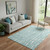 5' X 8' Teal And Ivory Vermicular Washable Area Rug With UV Protection