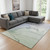 8' X 10' Artichoke Green Lavender And Ivory Abstract Washable Area Rug With UV Protection 8' X 10' Artichoke Green Lavender And Ivory Abstract Washable Area Rug With UV Protection