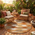 8' Orange And Brown Round Geometric Washable Indoor Outdoor Area Rug 8' Orange And Brown Round Geometric Washable Indoor Outdoor Area Rug