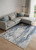 9' X 12' Ivory Blue And Black Abstract Power Loom Distressed Area Rug