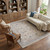 10' X 14' Ivory Tan and Blue Floral Hand Woven Distressed Area Rug With Fringe
