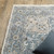 7' X 10' Blue And Ivory Medallion Distressed Area Rug With Fringe