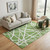 5' X 8' Green And Ivory Geometric Washable Area Rug With UV Protection 5' X 8' Green And Ivory Geometric Washable Area Rug With UV Protection
