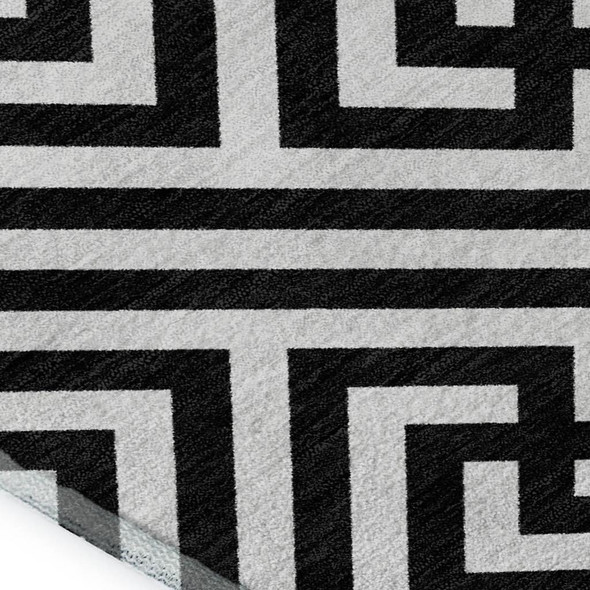 9' X 12' Black And Ivory Geometric Washable Area Rug With UV Protection