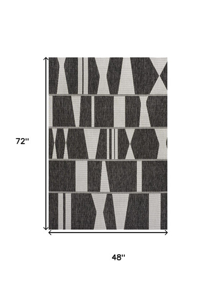 4' X 6' Black And Cream Geometric Indoor Outdoor Area Rug