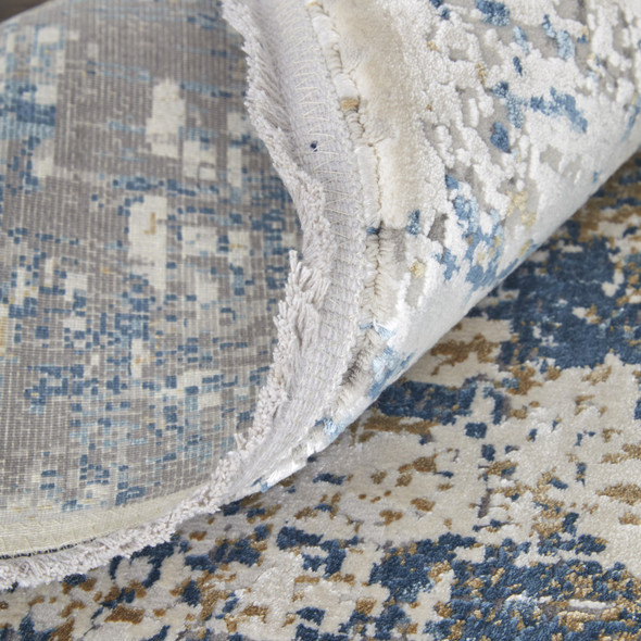 10' X 13' Ivory Tan and Blue Abstract Power Loom Area Rug With Fringe