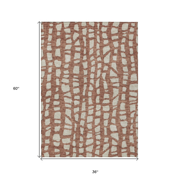 3' X 5' Orange And Ivory Abstract Washable Indoor Outdoor Area Rug