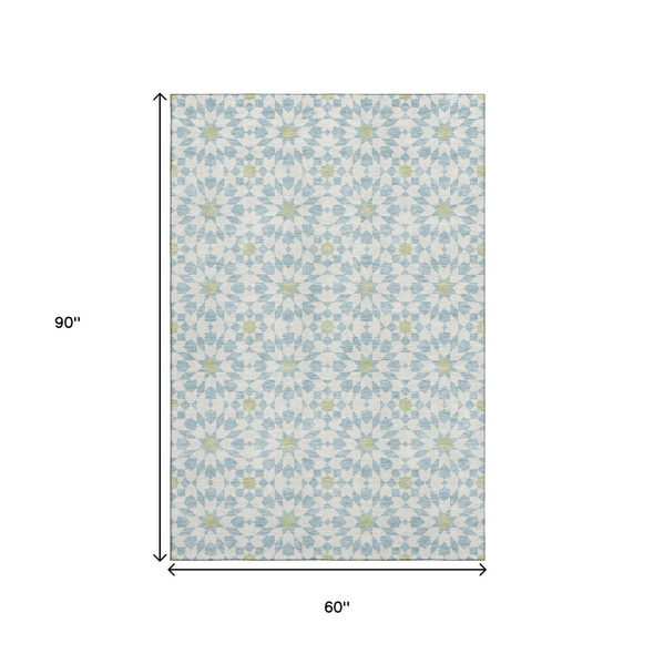5' X 8' Sky Blue Ivory And Green Geometric Washable Area Rug With UV Protection