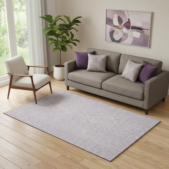 5' X 8' Lavender And Ivory Geometric Washable Area Rug With UV Protection