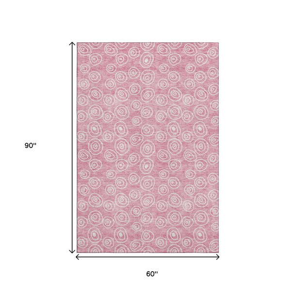 5' X 8' Pink And Ivory Polka Dot Washable Area Rug With UV Protection