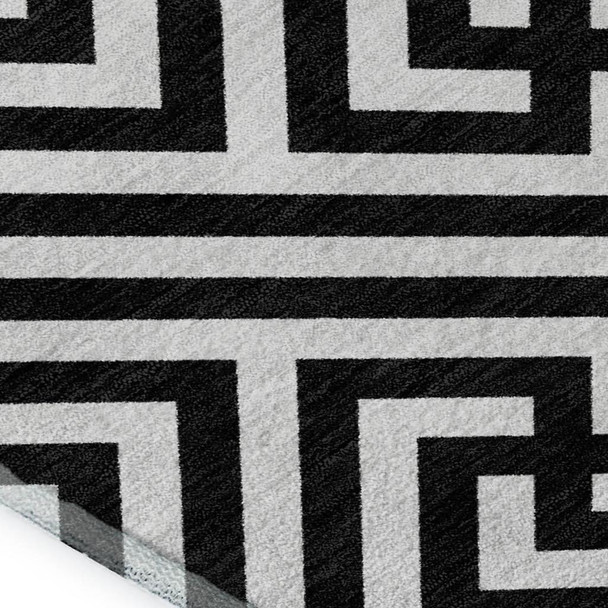 9' X 12' Black And Ivory Geometric Washable Area Rug With UV Protection