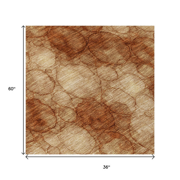 3' X 5' Rust And Orange Abstract Washable Indoor Outdoor Area Rug