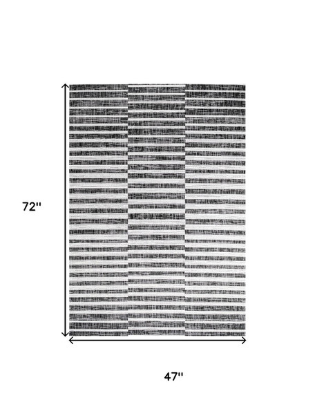 4' X 6' Black And Ivory Striped Indoor Outdoor Area Rug