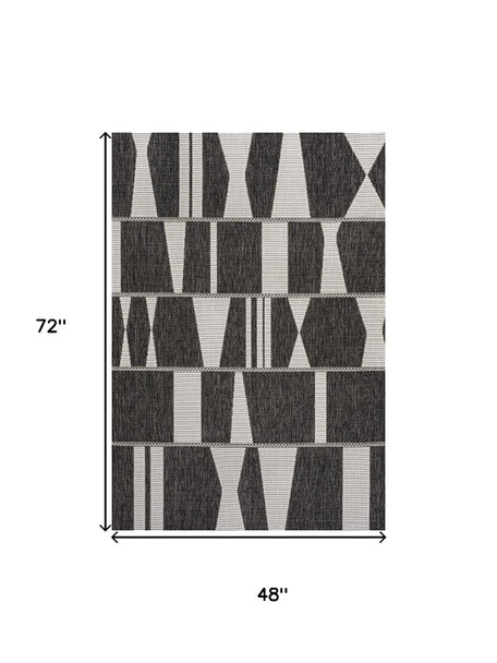 4' X 6' Black And Cream Geometric Indoor Outdoor Area Rug