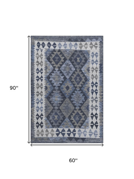 5' X 8' Navy Blue And Ivory Tribal Washable Area Rug With UV Protection