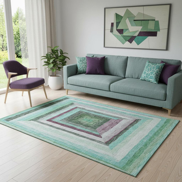5' X 8' Teal Mauve And Ivory Geometric Washable Area Rug With UV Protection