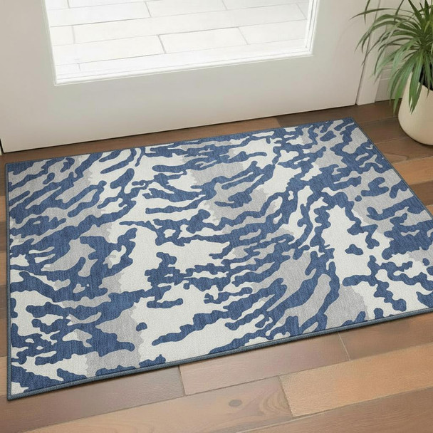 3' X 5' Navy Blue And Ivory Animal Print Washable Area Rug With UV Protection