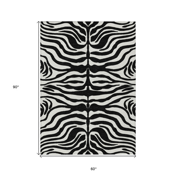 5' X 8' Black And Ivory Animal Print Washable Indoor Outdoor Area Rug