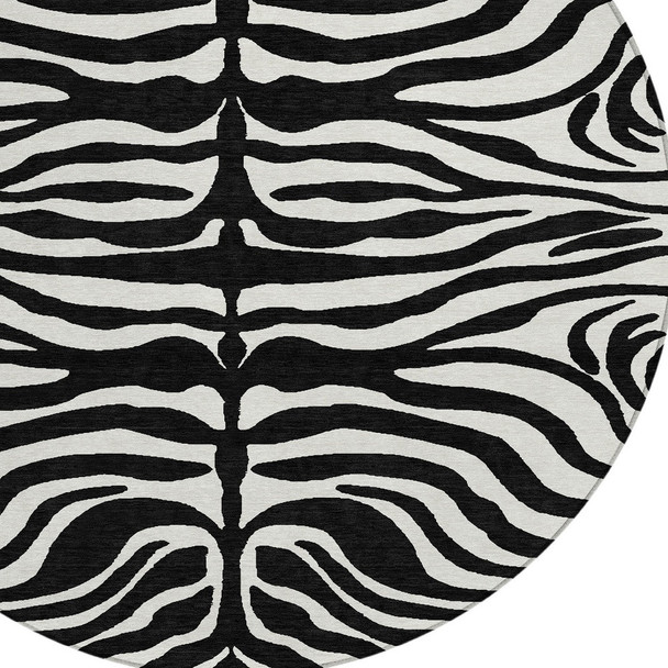8' Black And Ivory Round Animal Print Washable Indoor Outdoor Area Rug