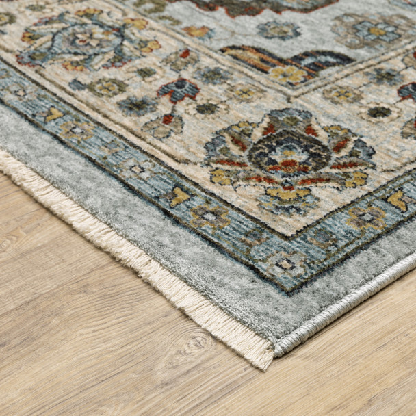 3' X 5' Blue Beige Grey Green Yellow And Rust Oriental Power Loom Stain Resistant Area Rug With Fringe