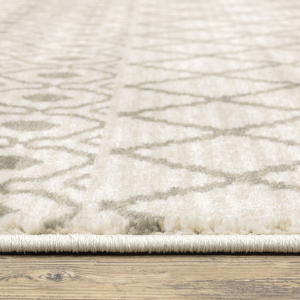 5' X 7' Ivory And Grey Geometric Power Loom Stain Resistant Area Rug