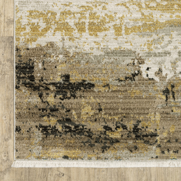 5' X 8' Grey Gold Black Charcoal And Beige Abstract Power Loom Stain Resistant Area Rug With Fringe