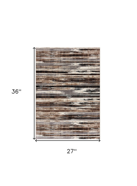2' X 3' Brown Ivory and Tan Abstract Washable Non Skid Area Rug