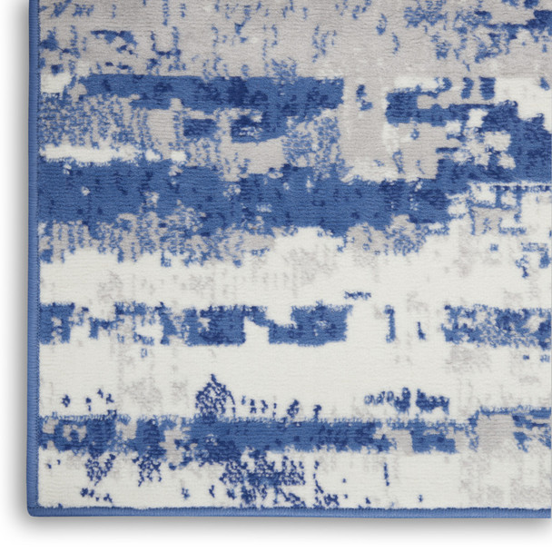 8' X 10' Ivory And Blue Abstract Distressed Area Rug