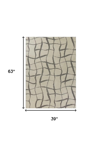 3' X 5' Ivory And Dark Gray Abstract Shag Area Rug