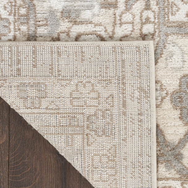5' X 7' Beige and Ivory Medallion Power Loom Distressed Area Rug