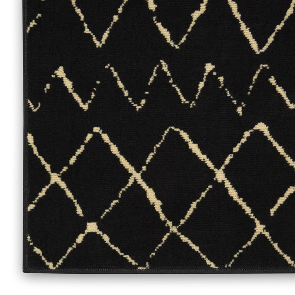 7' X 10' Black and Ivory Abstract Power Loom Distressed Area Rug