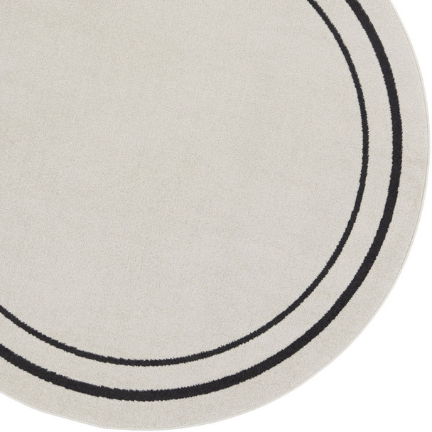 4' Ivory And Black Round Indoor Outdoor Area Rug