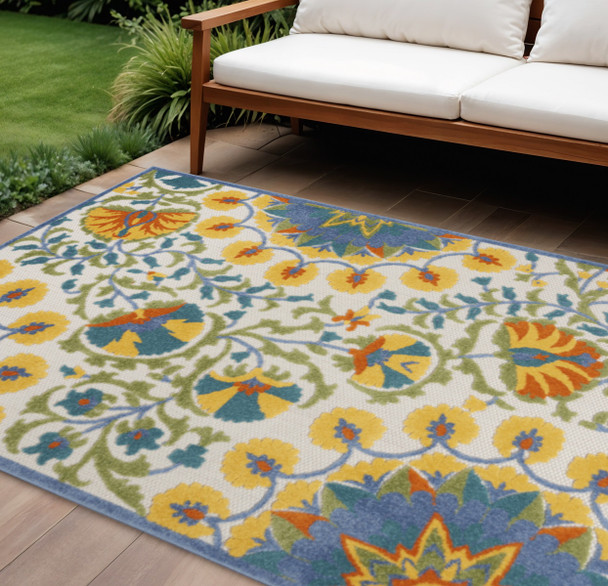 7' X 10' Ivory Blue Yellow And Orange Floral Indoor Outdoor Area Rug