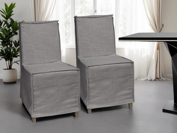 Set Of Two Gray And Brown Slipcovered Wood Parsons Chairs