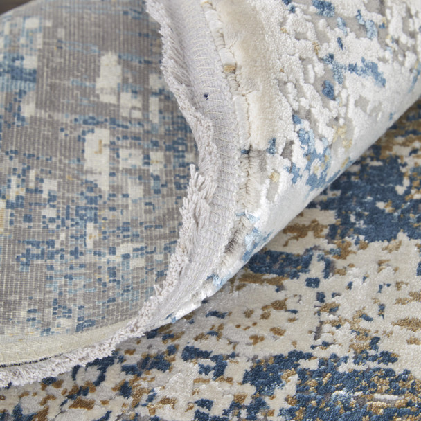 10' X 13' Ivory Tan and Blue Abstract Power Loom Area Rug With Fringe