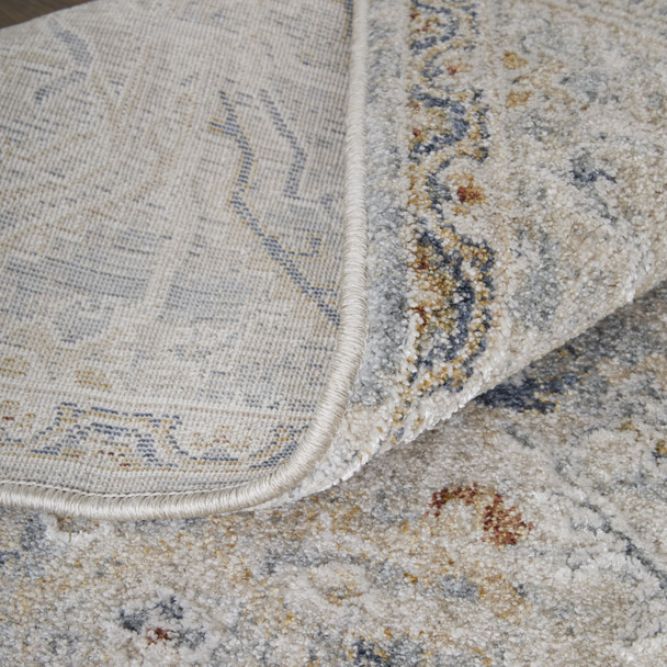 5' X 8' Ivory Tan and Blue Abstract Power Loom Worn Faded Area Rug With Fringe