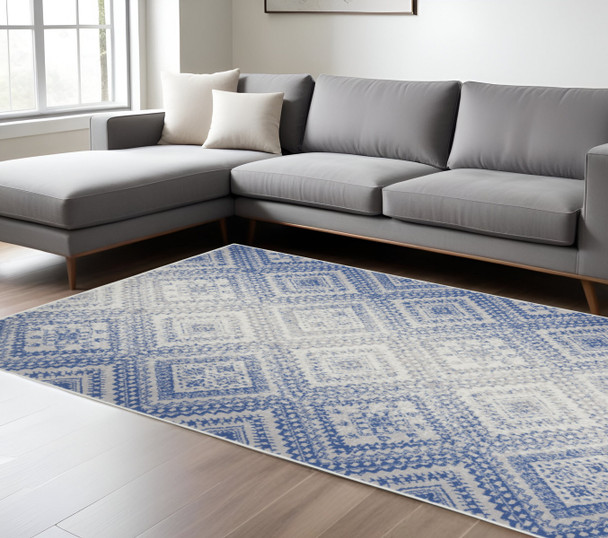 6' X 9' Ivory And Blue Geometric Area Rug