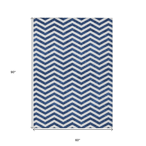 5' X 8' Navy Blue And Ivory Chevron Washable Indoor Outdoor Area Rug