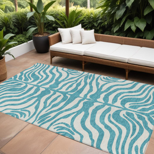 10' X 14' Teal Blue And Ivory Animal Print Washable Indoor Outdoor Area Rug
