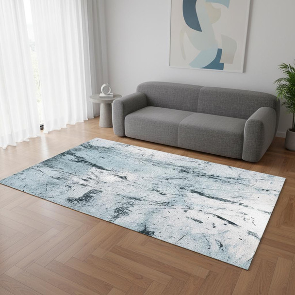 5' X 7' White And Blue Abstract Washable Area Rug With UV Protection